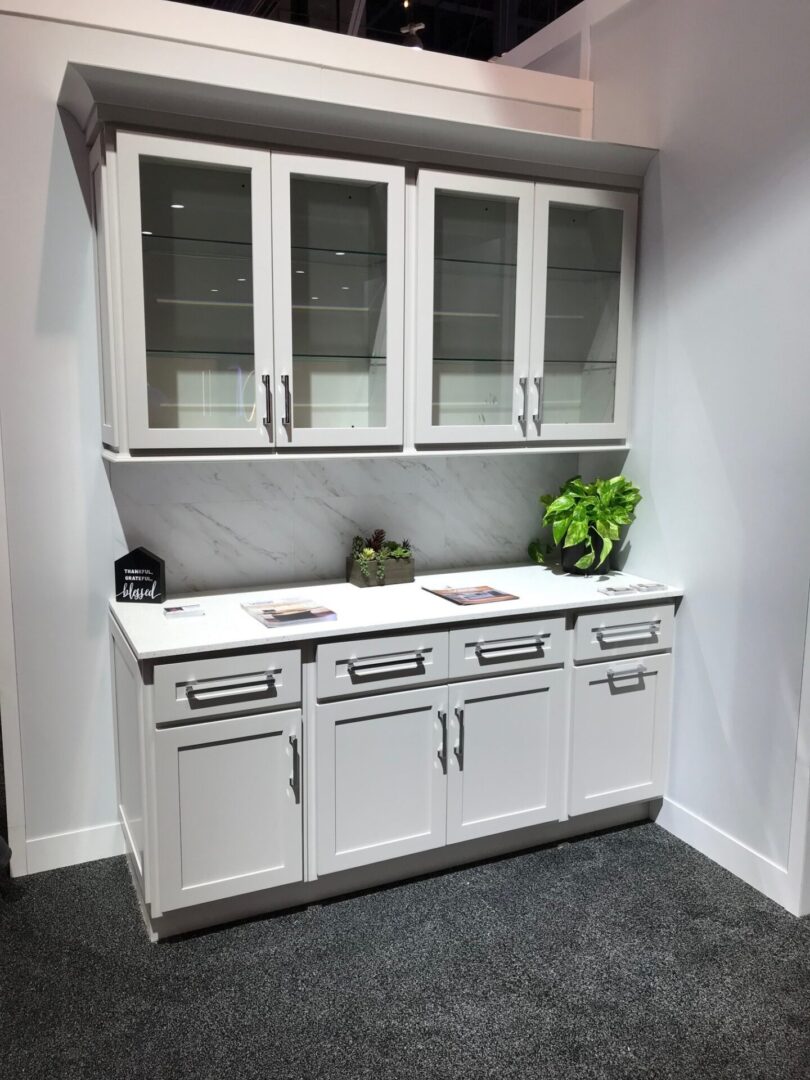 A kitchen system out for display in white with glass